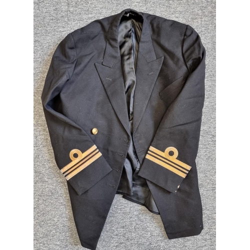 757 - A Royal Navy Lieutenant Commander's uniform, in a black painted steel travelling case.... 