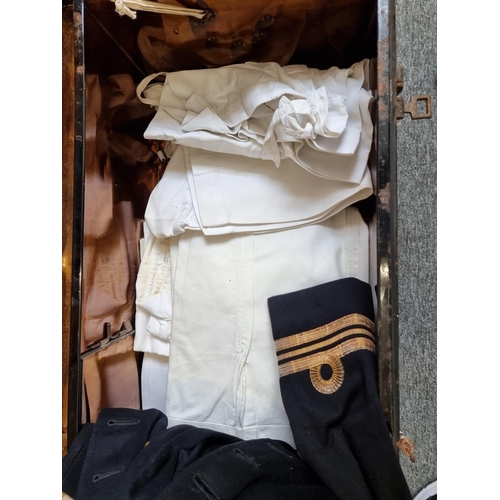 757 - A Royal Navy Lieutenant Commander's uniform, in a black painted steel travelling case.... 