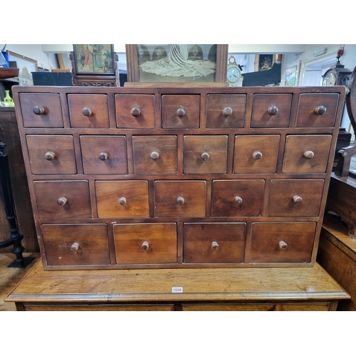 1029 - A mahogany multi-drawer chest, 57.5cm high x 90.5cm wide x 25cm deep.