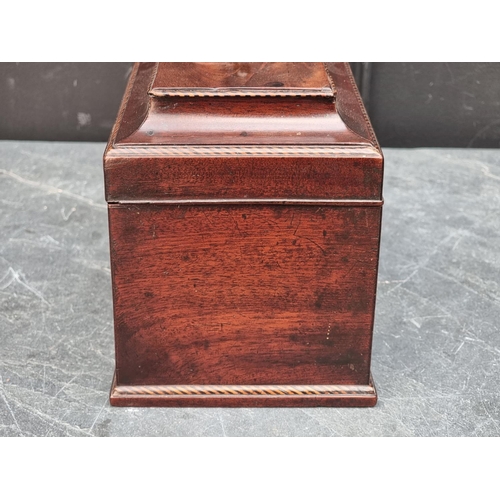 1036 - A George III mahogany and chequer strung tea caddy, with concealed lateral drawer, the interior inco... 