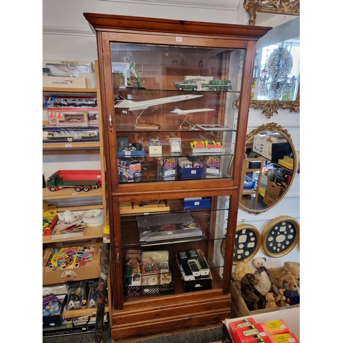 1077 - A large pine shop's display cabinet, 204.5cm high x 94.5cm wide x 45.5cm deep.