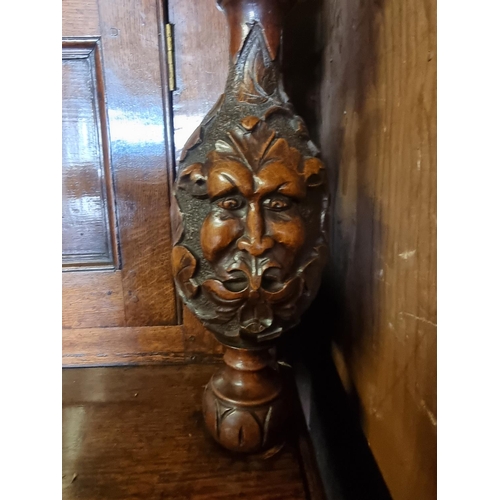 1080 - A large oak court cupboard, initialled and dated 1697, 181cm wide.