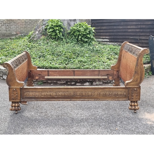 1084 - An antique continental gilt gesso bed, 139cm wide.