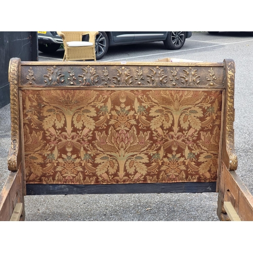 1084 - An antique continental gilt gesso bed, 139cm wide.