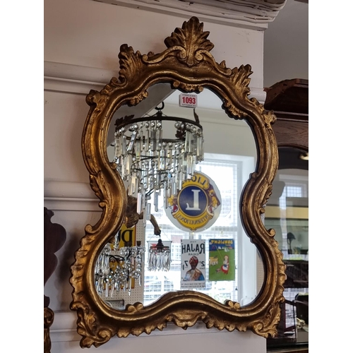 1093 - An 18th century style giltwood framed wall mirror, 53 x 37cm.