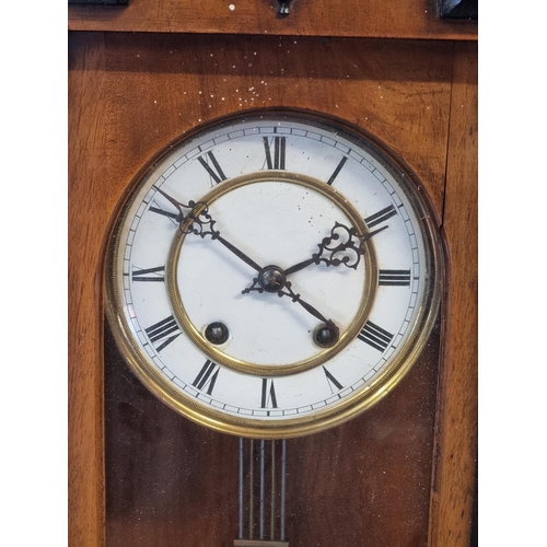 1101 - A late 19th century Vienna style walnut and ebonised wall clock, 88.5cm high.