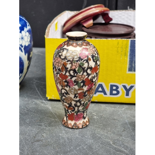 1351 - A mixed lot of Chinese and other items, to include a blue and white prunus vase, 25.5cm high.... 