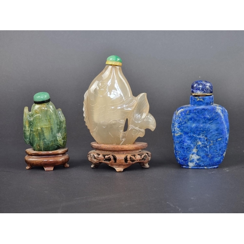 1384 - Three Chinese carved hardstone snuff bottles and stoppers, probably Qing, comprising: a lapis l... 