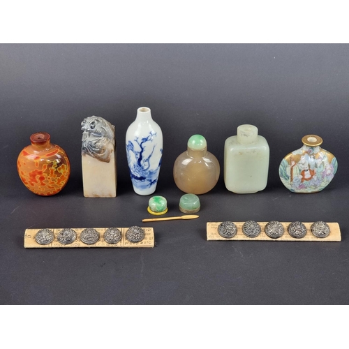 1387 - An interesting group of antique Chinese snuff bottles, to include a celadon jade example; together w... 