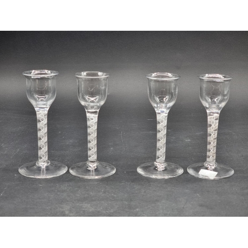 1397 - A set of four antique style double series opaque twist wine glasses, 14cm high. (4)