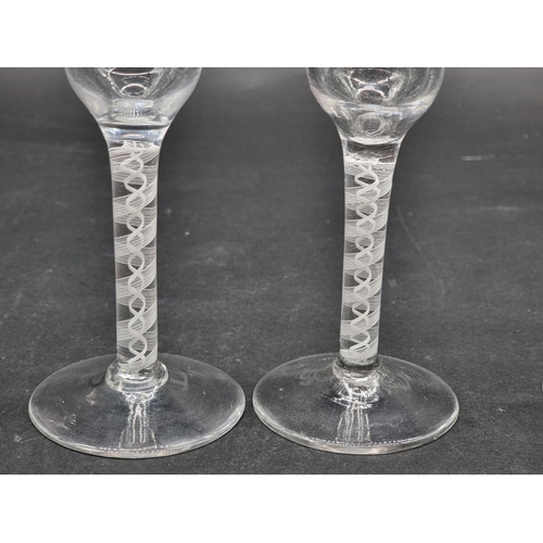 1397 - A set of four antique style double series opaque twist wine glasses, 14cm high. (4)