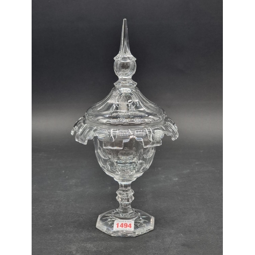 1494 - An antique cut glass pedestal cup and cover, possibly Irish, the cover etched with a standing figure... 