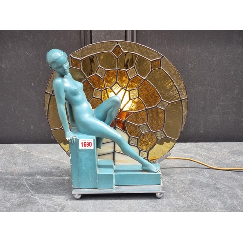 1690 - An Art Deco plaster and leaded glass figural table lamp, 33.5cm high.