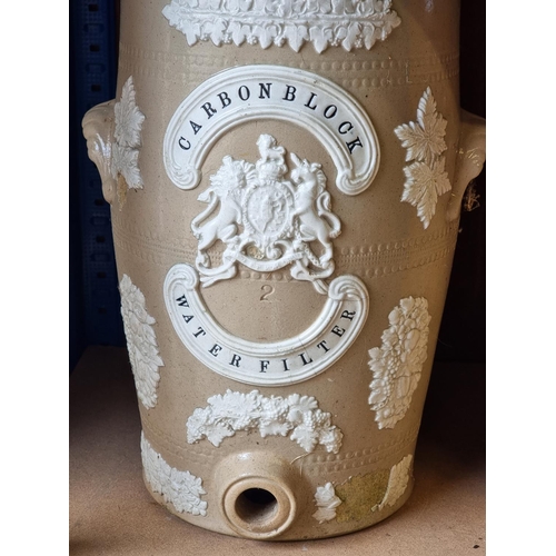 1726 - A Victorian stoneware 'Carbon Block Water Filter', 38cm high, (losses to decoration); together with ... 