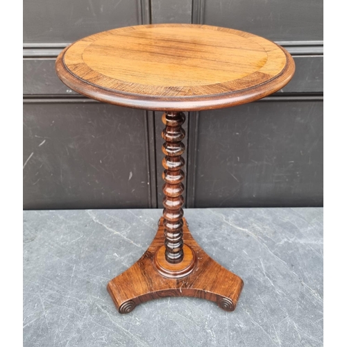 1050A - A small antique rosewood wine table, 37.5cm diameter.