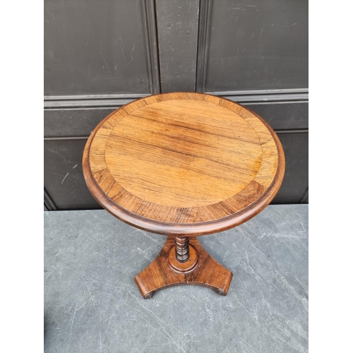 1050A - A small antique rosewood wine table, 37.5cm diameter.