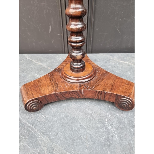 1050A - A small antique rosewood wine table, 37.5cm diameter.