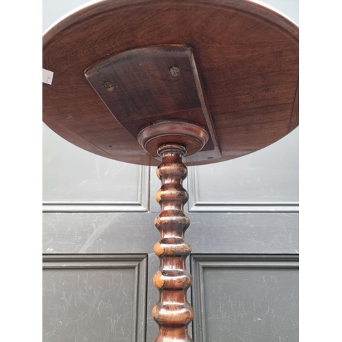 1050A - A small antique rosewood wine table, 37.5cm diameter.