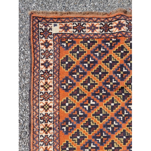 1114 - A Persian rug, having repeated decoration to central field, together with another Persian rug, havin... 