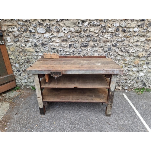 1720 - An old pine workbench, with small attached vice, 138cm wide.