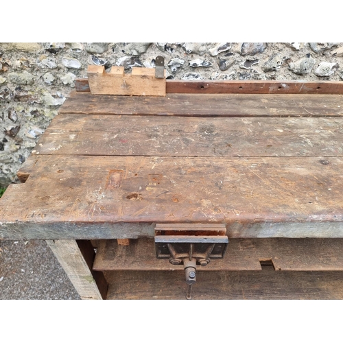 1720 - An old pine workbench, with small attached vice, 138cm wide.