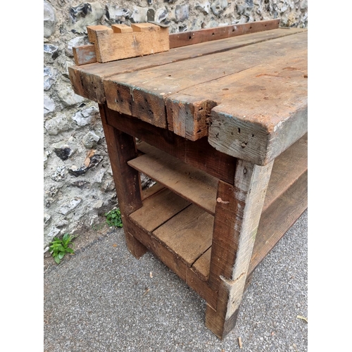 1720 - An old pine workbench, with small attached vice, 138cm wide.