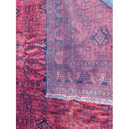 1120 - A large Afghan Khal rug, having repeated geometric decoration, 336 x 247cm.