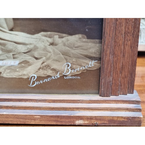 1360A - An Art Deco oak photograph frame, contained a contemporary sepia image of a lady in a wedding dress,... 