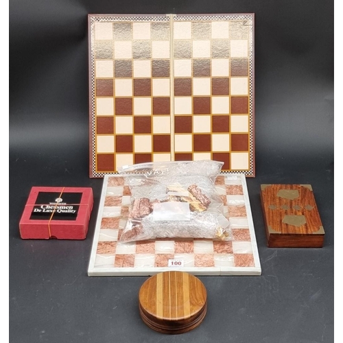 100 - Pastimes: a pink and white hardstone chess board and matching pieces; together with another chess bo... 