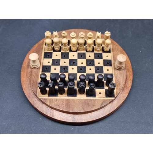 100 - Pastimes: a pink and white hardstone chess board and matching pieces; together with another chess bo... 