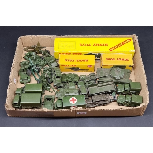 109 - Dinky: a tray of playworn military vehicles, including tanks, guns and jeeps; together with three bo... 