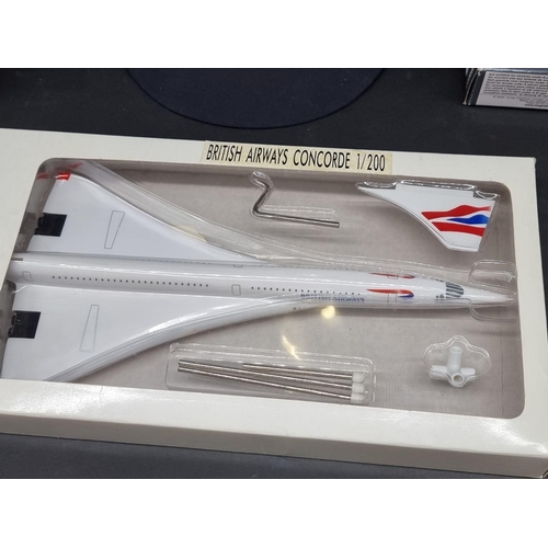 112 - Concorde: a Corgi 2 piece set No. CSCA05002; together with a British Airways 1/200 plastic model; an... 