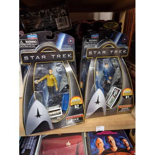 120 - Star Trek: a large collection of various action figures; books and trading cards; a Star Trek p... 