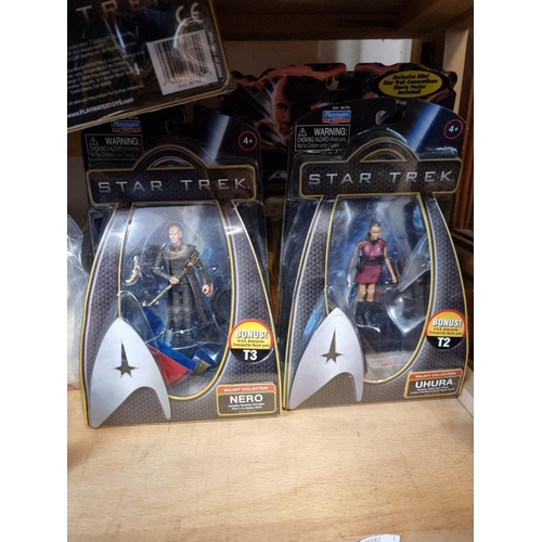 120 - Star Trek: a large collection of various action figures; books and trading cards; a Star Trek p... 