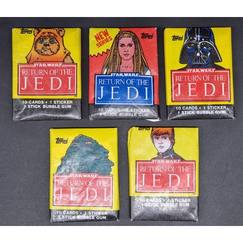 127 - Star Wars: five packs of Topps 'Return of the Jedi' bubblegum cards, 4 sealed in original waxpa... 