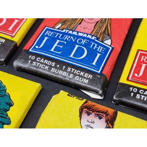 127 - Star Wars: five packs of Topps 'Return of the Jedi' bubblegum cards, 4 sealed in original waxpa... 