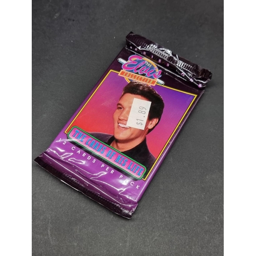 129 - Trading Cards: The Elvis Collection, a large quantity of sealed and opened cards.