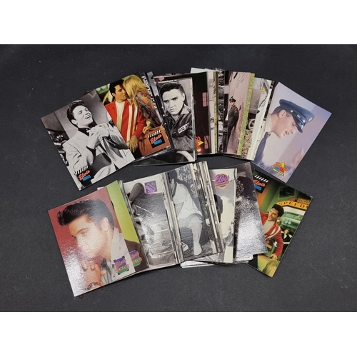 129 - Trading Cards: The Elvis Collection, a large quantity of sealed and opened cards.