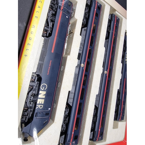 179 - Hornby: a boxed GNER train pack, R2002; together with another (three coaches only).... 