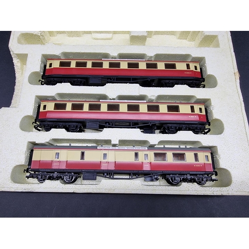 179 - Hornby: a boxed GNER train pack, R2002; together with another (three coaches only).... 