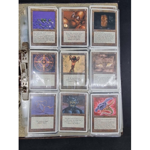 180 - Magic of the Gathering: two binders containing a large collection of trading cards, most dated ... 