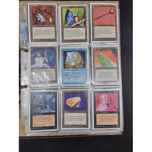 180 - Magic of the Gathering: two binders containing a large collection of trading cards, most dated ... 