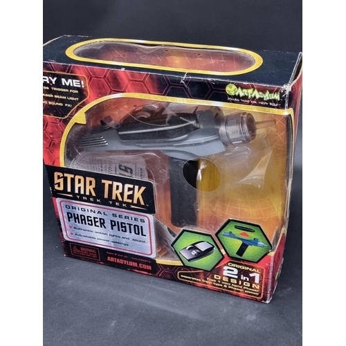 184 - Star Trek: a boxed 2003 Phaser Pistol, by Art Asylum; together with 11 (9 sealed) mini-sheets of Sta... 