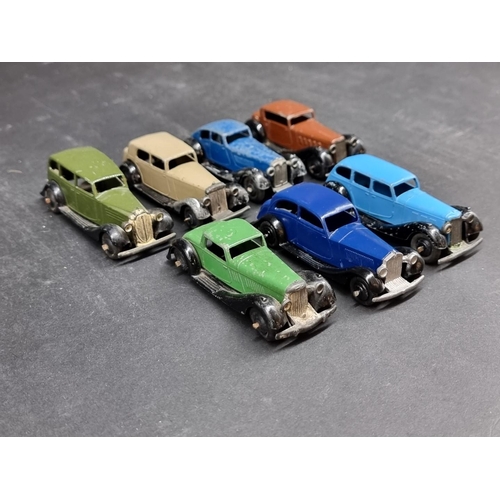 197 - Dinky: a group of seven vintage unboxed cars, to include a tan/black Daimler and a Vauxhall Saloon i... 