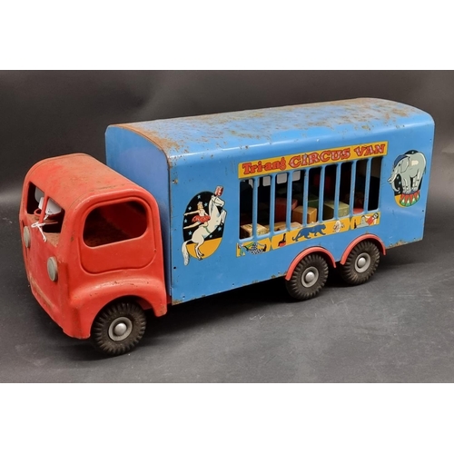 207 - Triang: a large vintage tinplate circus van, 60cm long; together with a quantity of unrelated wooden... 