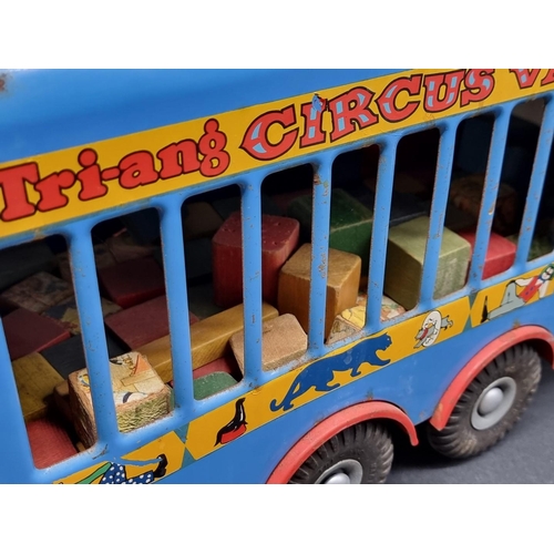 207 - Triang: a large vintage tinplate circus van, 60cm long; together with a quantity of unrelated wooden... 