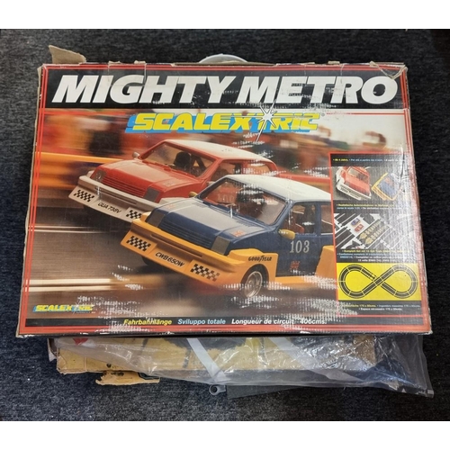 216 - Scalextric: a vintage boxed 'Mighty Metro' racing car set and a part set 'Scalextric Rally 45'; toge... 