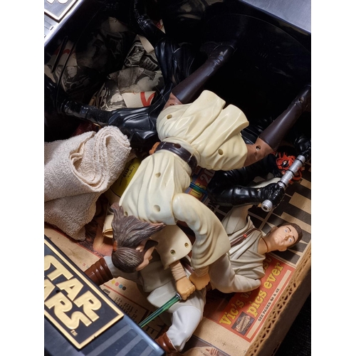 229 - Star Wars: a collection of various merchandise in two boxes relating to the series, to include ... 