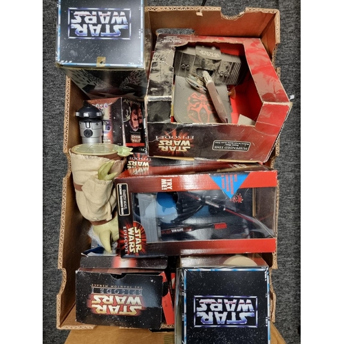 229 - Star Wars: a collection of various merchandise in two boxes relating to the series, to include ... 