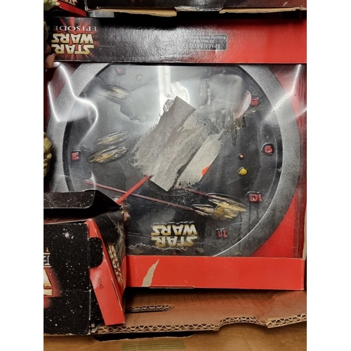 229 - Star Wars: a collection of various merchandise in two boxes relating to the series, to include ... 